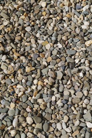 Background composed of thousands of small stones, vertical frameの写真素材