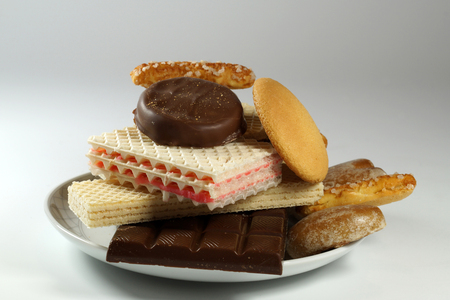 A plate full of various sweets, an unhealthy way of feedingの写真素材