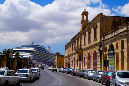 Port street in the Mediterranean city, in the background, a huge cruise shipの写真素材