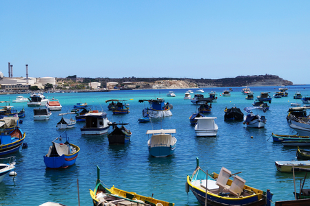Sea bay full of mooring boats, blue water, blue skyの写真素材
