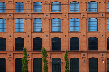 The building of the old factory has been renovated and revitalized. Color scheme, window arrangement, type of construction in the restoration process have been preserved.の写真素材