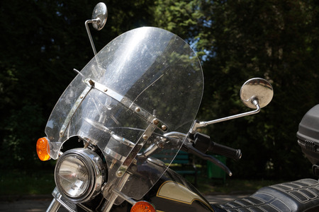 Motorcycle view, windshield, reflector and mirrors on a dark backgroundの写真素材