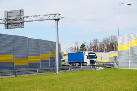 The road is protected against noise emission by noise-absorbing barrier (also called a soundwall,...