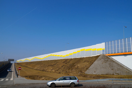 Acoustic wall that protects residents against noise generated by passing carsの写真素材