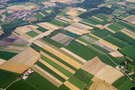 Panorama of large fields, view of a small town from a bird's eye viewの写真素材