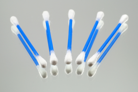 Cotton swabs, cosmetics, ear cleaning accessories, arranged on the mirrorの写真素材
