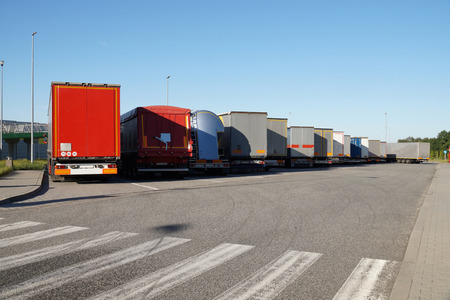 Travel plaza (truck stop) a place to rest, view of the back of parked trucksの写真素材