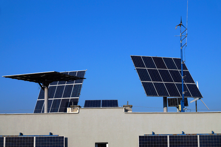 Acquiring green energy, photovoltaic panels and windmillsの写真素材