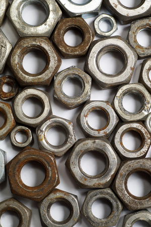 Surface made up of several hundred metal screw nuts-macroの写真素材