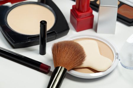 A basic set of cosmetics for makeup on a white backgroundの写真素材