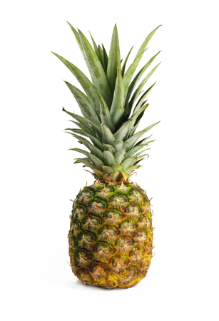 Fully ripe pineapple, view of whole fruit, white bacground, close upの写真素材