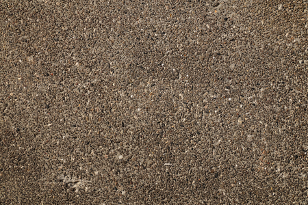 The surface of the concrete wall, the plaster consists of thousands of small, multi-colored pebbles.の写真素材