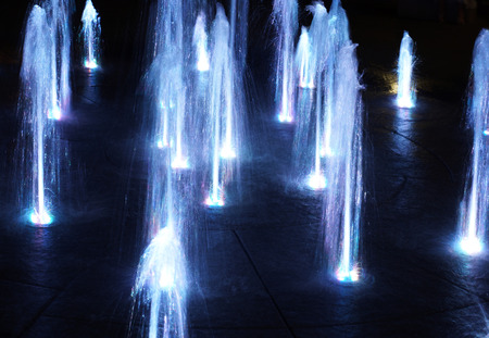 View of the city fountain at night. LED lighting.の写真素材