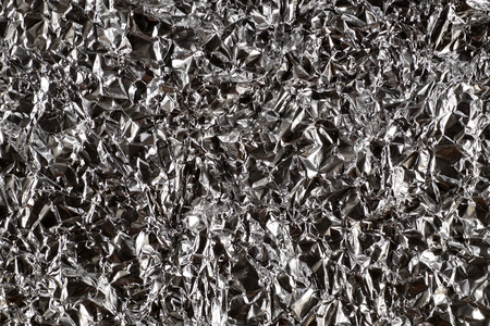 Structure. Metallic and contrasting background obtained from crumpled aluminum foil.の写真素材