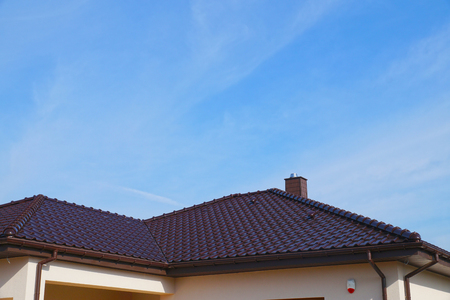 A roof fragment made of ceramic tiles, a newly built residential house.の写真素材