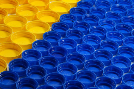 Recyclable materials. Bottle caps made of HDPE (high-density polyethylene) segregated according to...