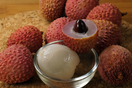 For a tasty dessert. Lychee fruits: sliced, peeled and whole fruit.の写真素材