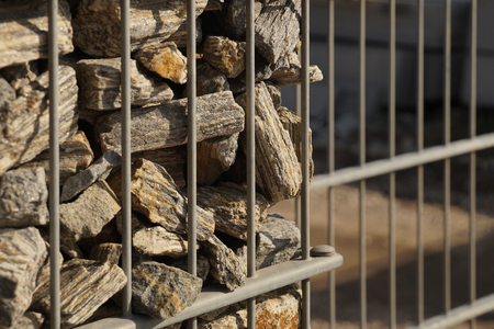 Gabion. Close-up on a steel, galvanized structure filled with spectacular pieces of rock.の写真素材