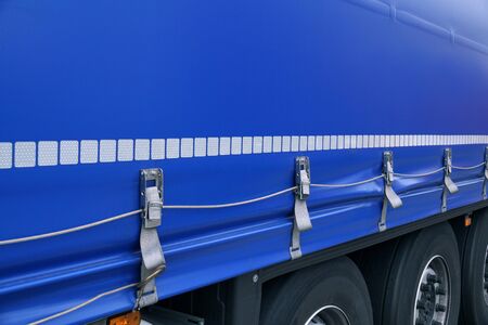 Truck transport. View of the tarpaulin covering the semi-trailer of the truck.の写真素材