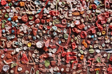 Gum wall. Chewing gums stuck to the wall. One of the tourist attractions  in Post Alley in Downtown Seattle.の写真素材