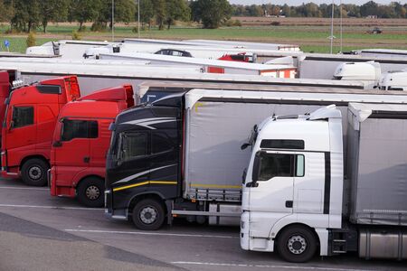 A row of trucks during a stopover. Truck stop. の写真素材