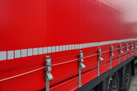 Truck transport. View of the tarpaulin covering the semi-trailer of the truck.の写真素材
