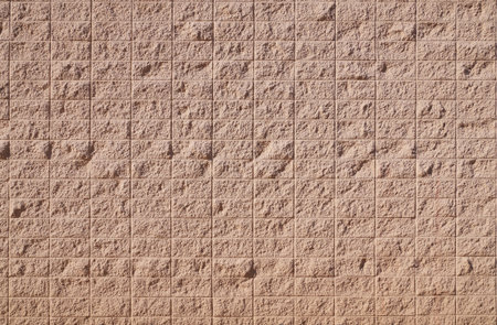 New wall surface. A pattern simulating the surface of tiles has been applied to the plaster.