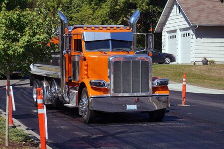 A city in the USA. Truck (dump truck) during street repair work.の写真素材