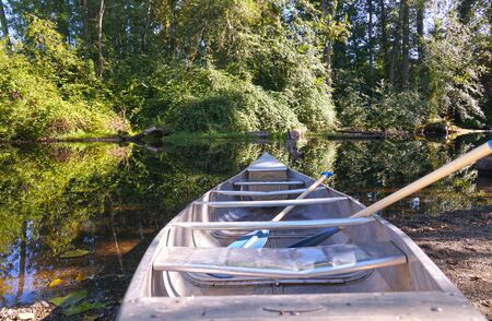USA. Washington state. Seattle. A boat with oars on the shore of Foster Island.の写真素材