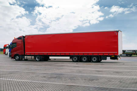 Break in a trip. A red truck with a red trailer.の写真素材