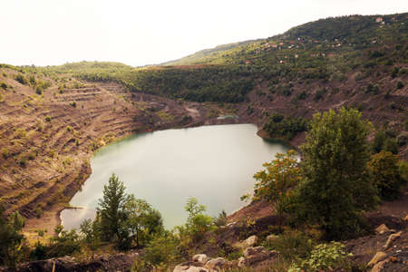 The city of Pecs in southern Hungary. The area of the exploited opencast Carolina coal mine.の写真素材