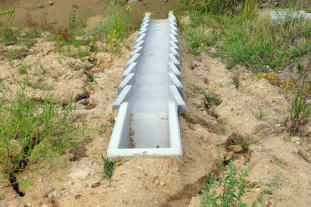 Construction of the highway. A system of concrete modules for draining excess water from the road surface.の写真素材