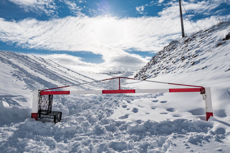 Mountain road closed by snowの写真素材