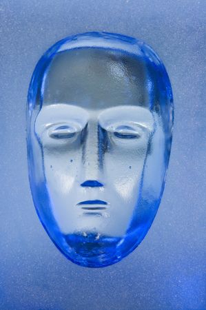 Human face in glass block  の写真素材