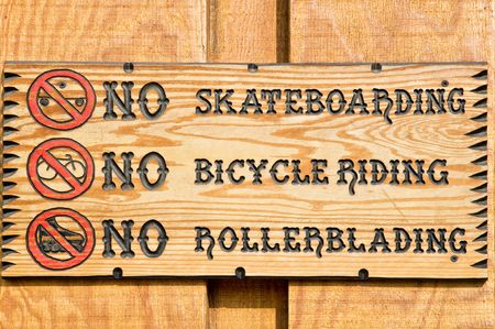 Restrictive sign on wooden wallの写真素材