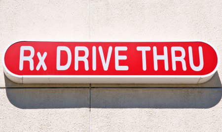 Rx Drive Thru sign on stucco wallの写真素材