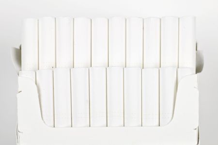 Open pack of cigarettes over whiteの写真素材