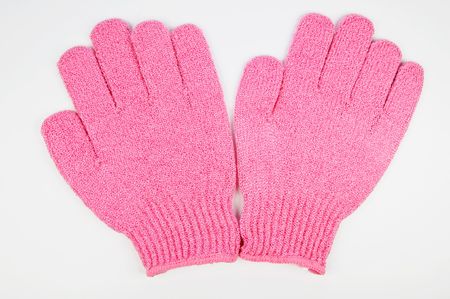 Body-smoothing scrub gloves - closeup isolated on whiteの写真素材