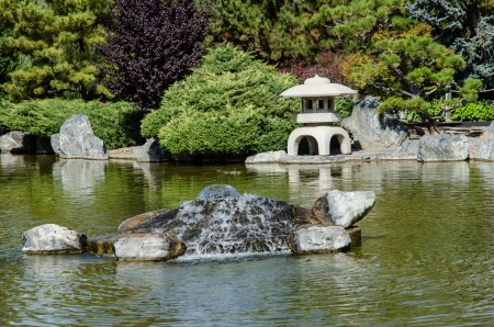Japanese garden - landscape with pond and fountain の写真素材