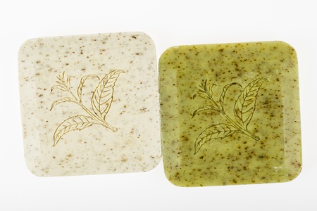 Colorful soap bars with floral pattern - macro isolated on whiteの写真素材