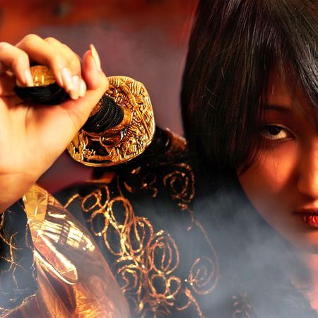 Portrait of beautiful east girl with a sword.の写真素材