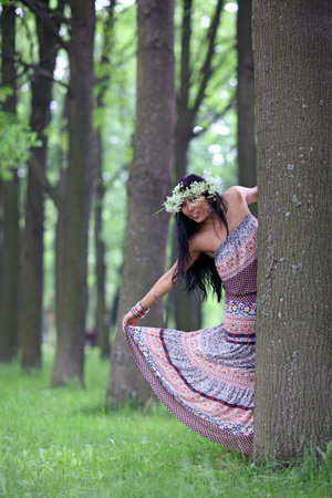 Portrait of the beautiful young girl in the spring in park
