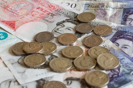 Pile of money and coins british pounds sterling gbp for business and finance