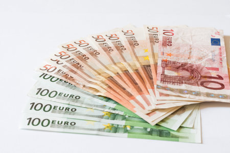 Pile of money Euros isolated on white for business and finance