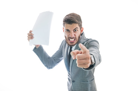 Very angry business man. Boss getting angry with employee and firing himの写真素材