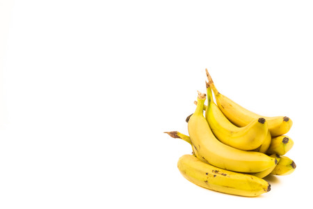 Bunch of ripe bananas isolated on a white background with copy space for text. Organic fruits for a healthy diet and lifestyleの写真素材