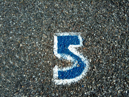 number five painted on asphalt