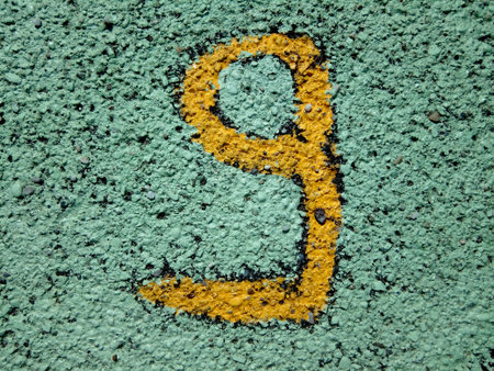 number nine painted on asphalt