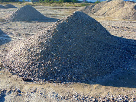 several piles of gravel for construction workの写真素材