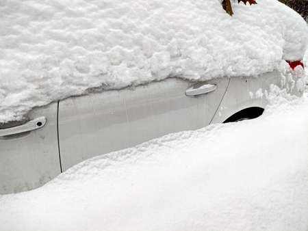snow covered car in the winterの写真素材